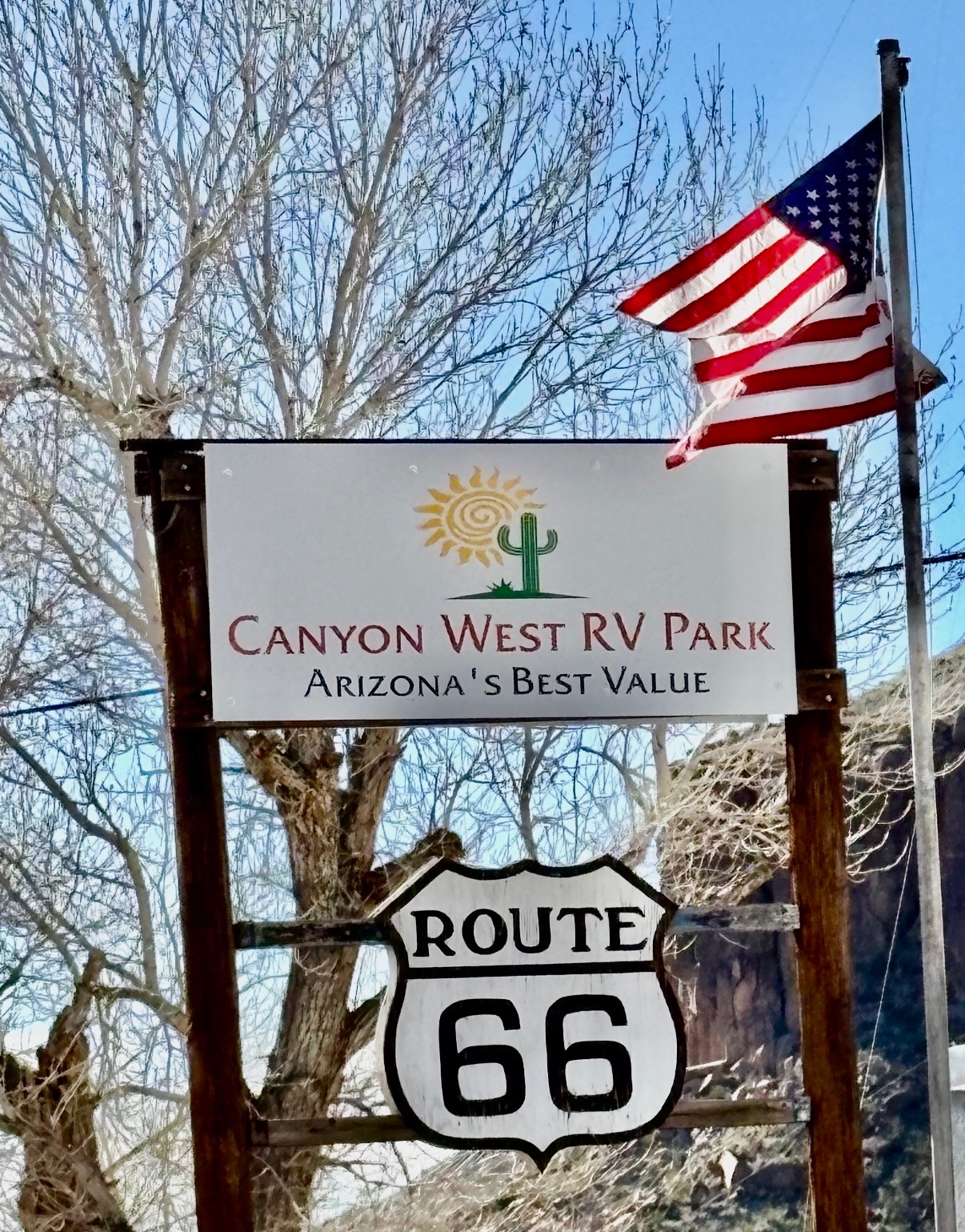 Canyon West RV Park sign with American flag on Route 66